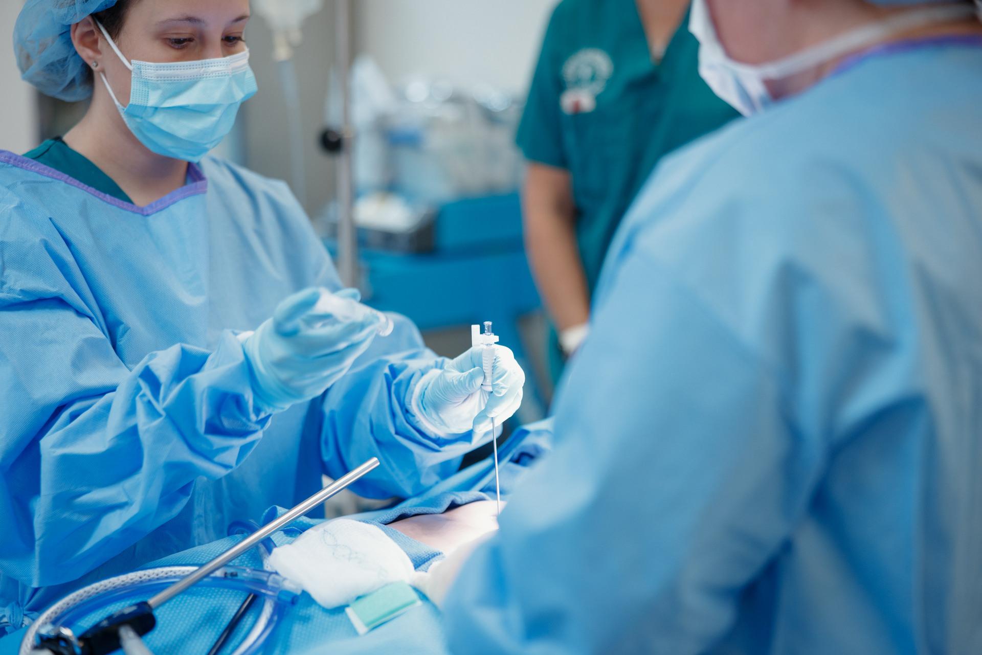 Female surgery student with a training dummy